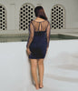 Elegant navy cocktail dress with bead detailing for parties.
