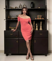 Varie coral off-shoulder cocktail dress with padded cups.

