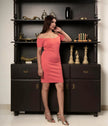 Women’s coral pink bardot party dress with inbuilt bra.
