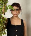 Elegant black button-down dress for office and evening wear.
