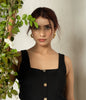 Elegant black button-down dress for office and evening wear.
