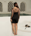 Elegant black cocktail party dress with padded cups.
