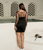 Elegant black cocktail party dress with padded cups.
